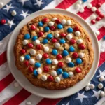 Festive dessert table with patriotic cookie cake and decorations