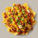 Nacho dish with minced meat, cheese and chili sauce