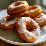 Pumpkin Doughnuts ~ So incredibly moist and soft... They are loaded with delicious pumpkin flavor.